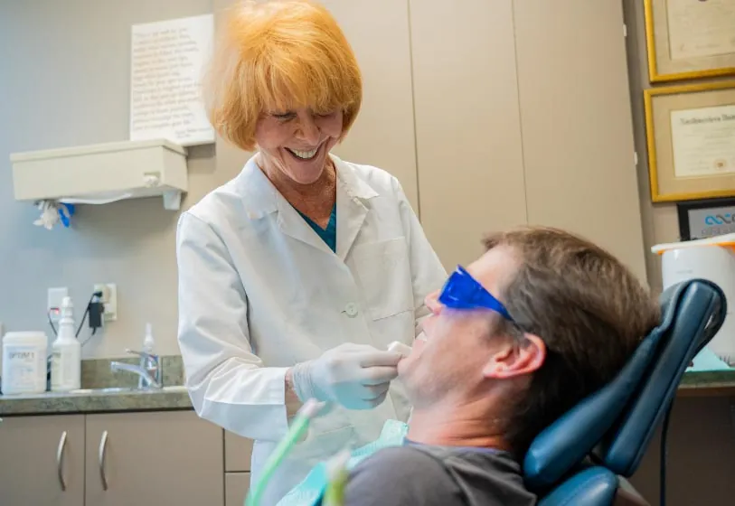 Austin dentist Dr. DeVry providing dental care to a patient at Brilliant Smiles
