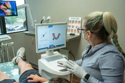 patient receiving restorative dental care at Brilliant Smiles in Austin, TX